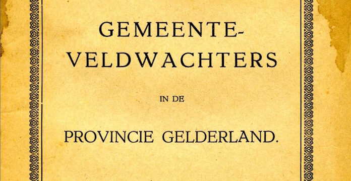 een uitsned van een archiefstuk. Het stuk is geel en er staat op: Gemeenteveldwachters in de provincie Gelderland.